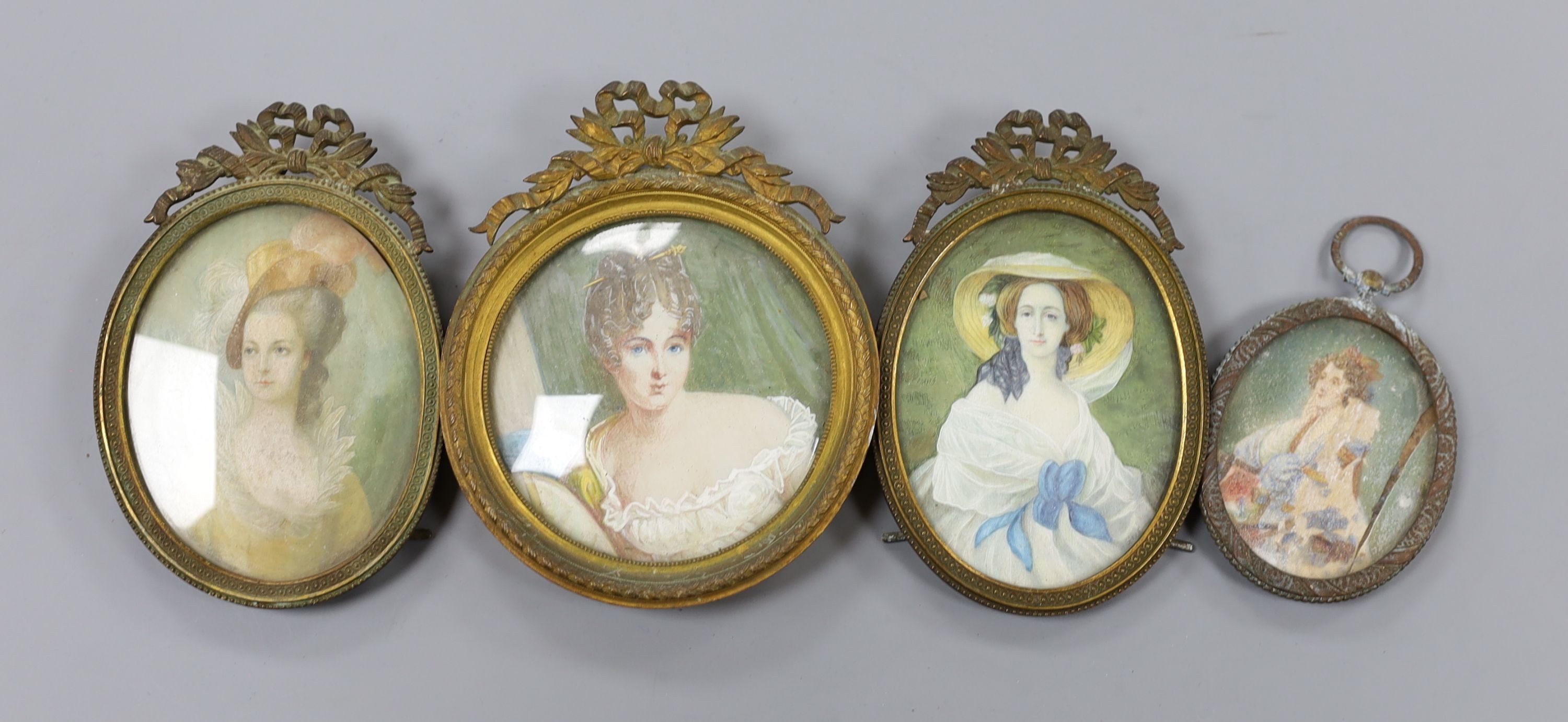 A group of four brass framed portrait miniatures